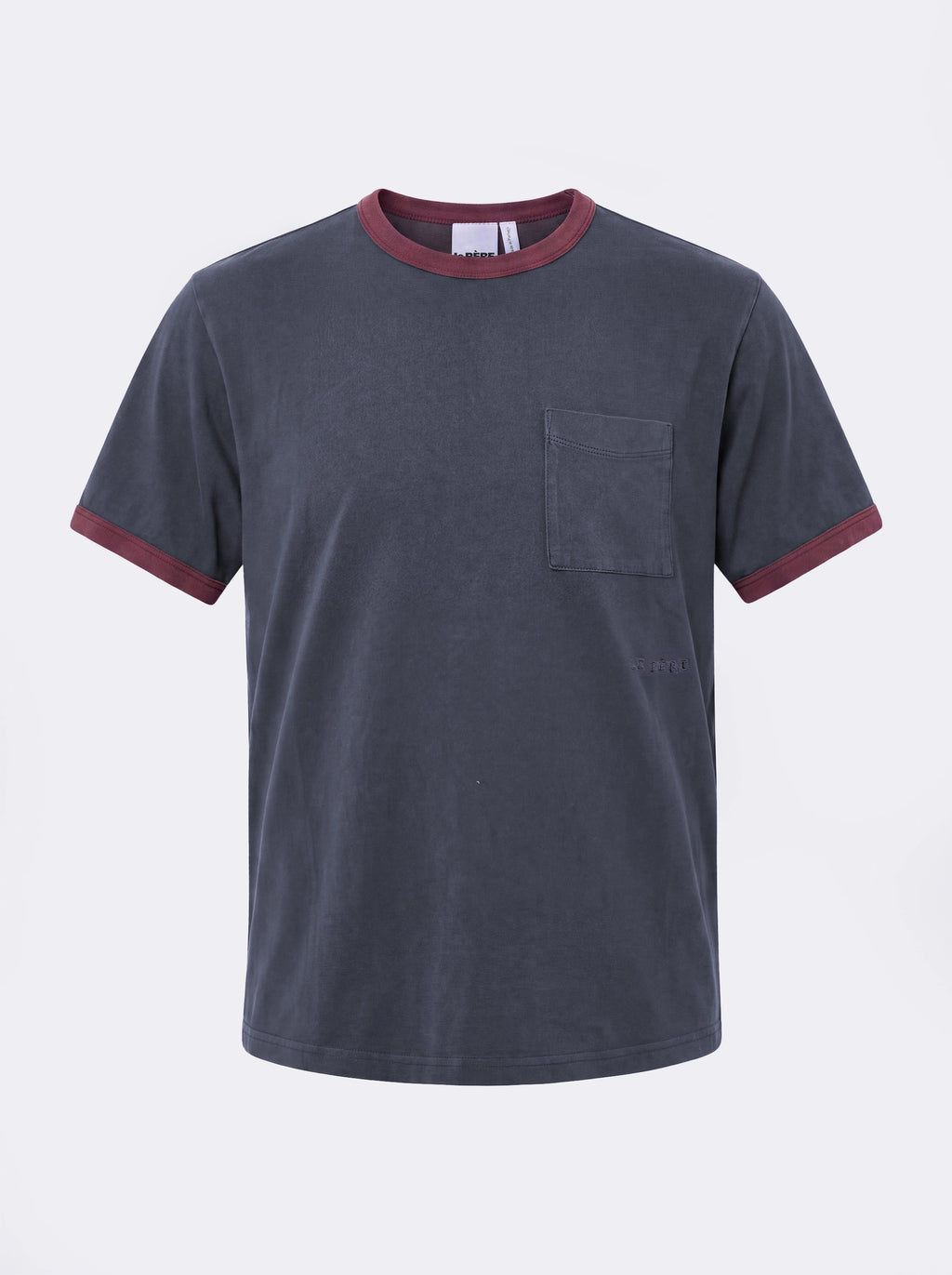 Ringer Tee — Washed navy t-shirt with burgundy contrast trim, featuring a chest pocket and tonal LE PÈRE embroidery. A refined take on the classic ringer tee with a relaxed, vintage-inspired feel.