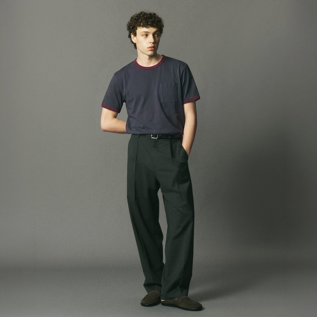 Ringer Tee — Washed navy t-shirt with burgundy contrast trim, featuring a chest pocket and tonal LE PÈRE embroidery. A refined take on the classic ringer tee with a relaxed, vintage-inspired feel.