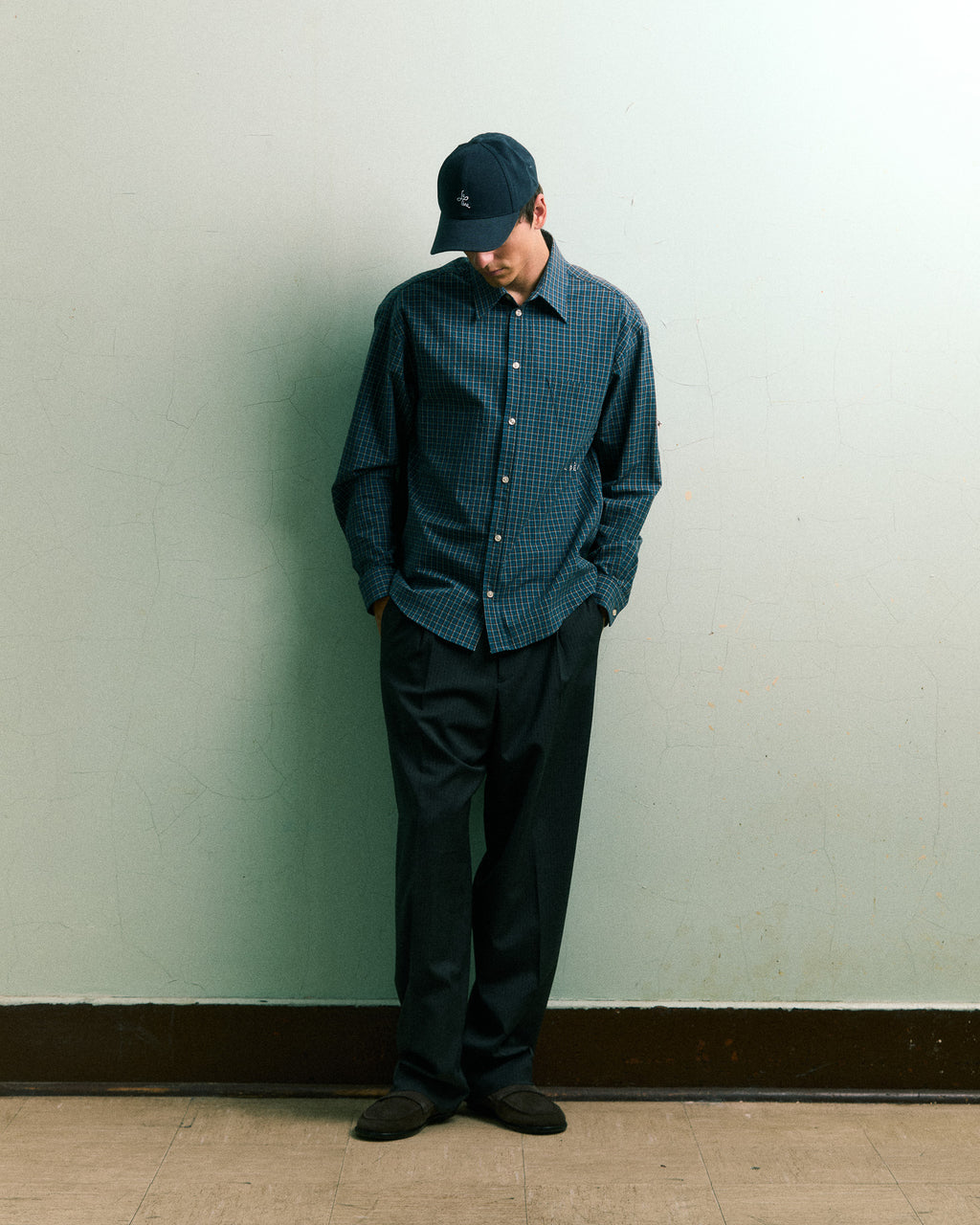 Minimal look — model wearing LE PÈRE blue check shirt with clean styling