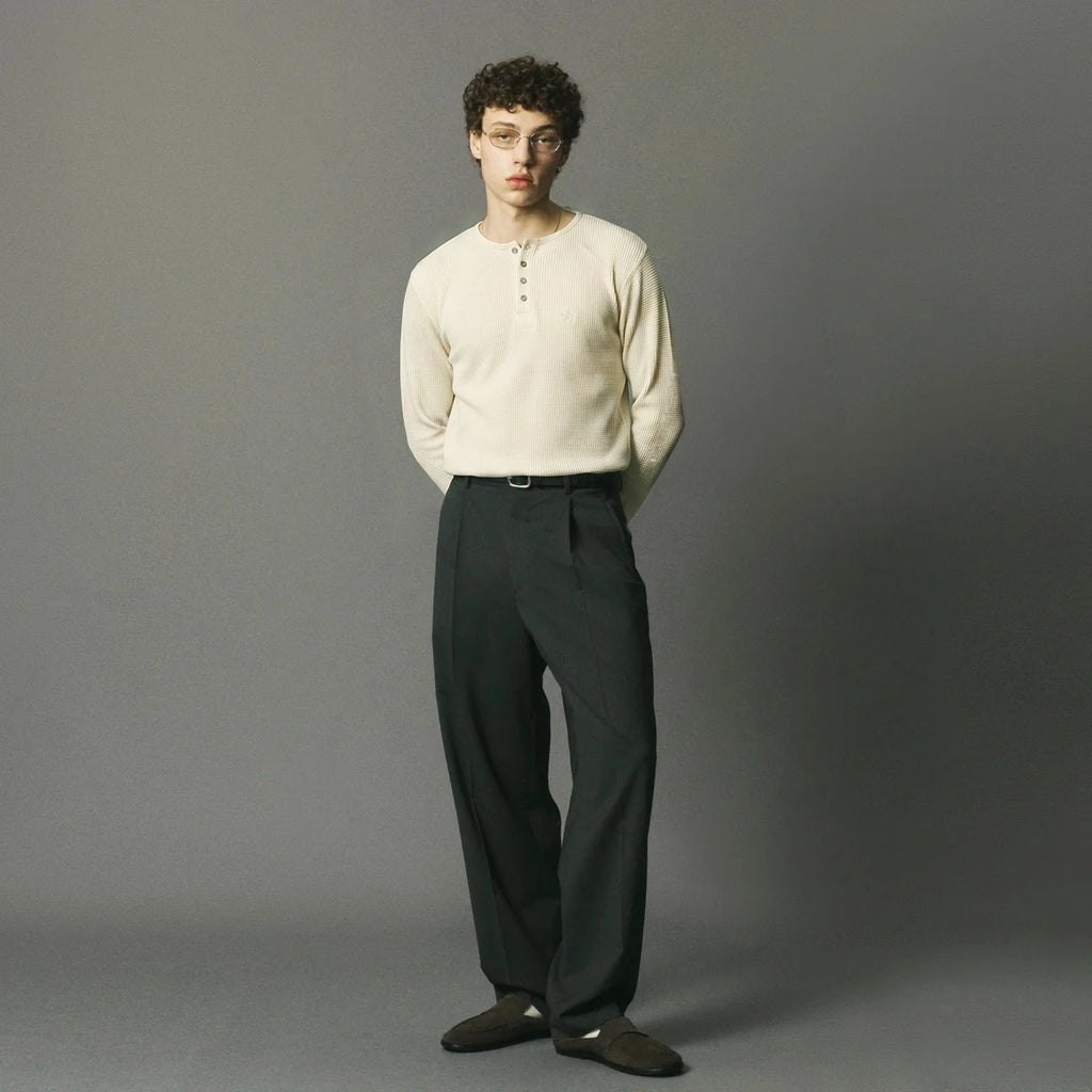 Woven from 100% premium Portuguese cotton, the Long Sleeve Henley reimagines a utilitarian classic in an ecru waffle knit.